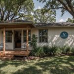 Beautiful modern vacation home with Vodyssey logo in a serene natural setting